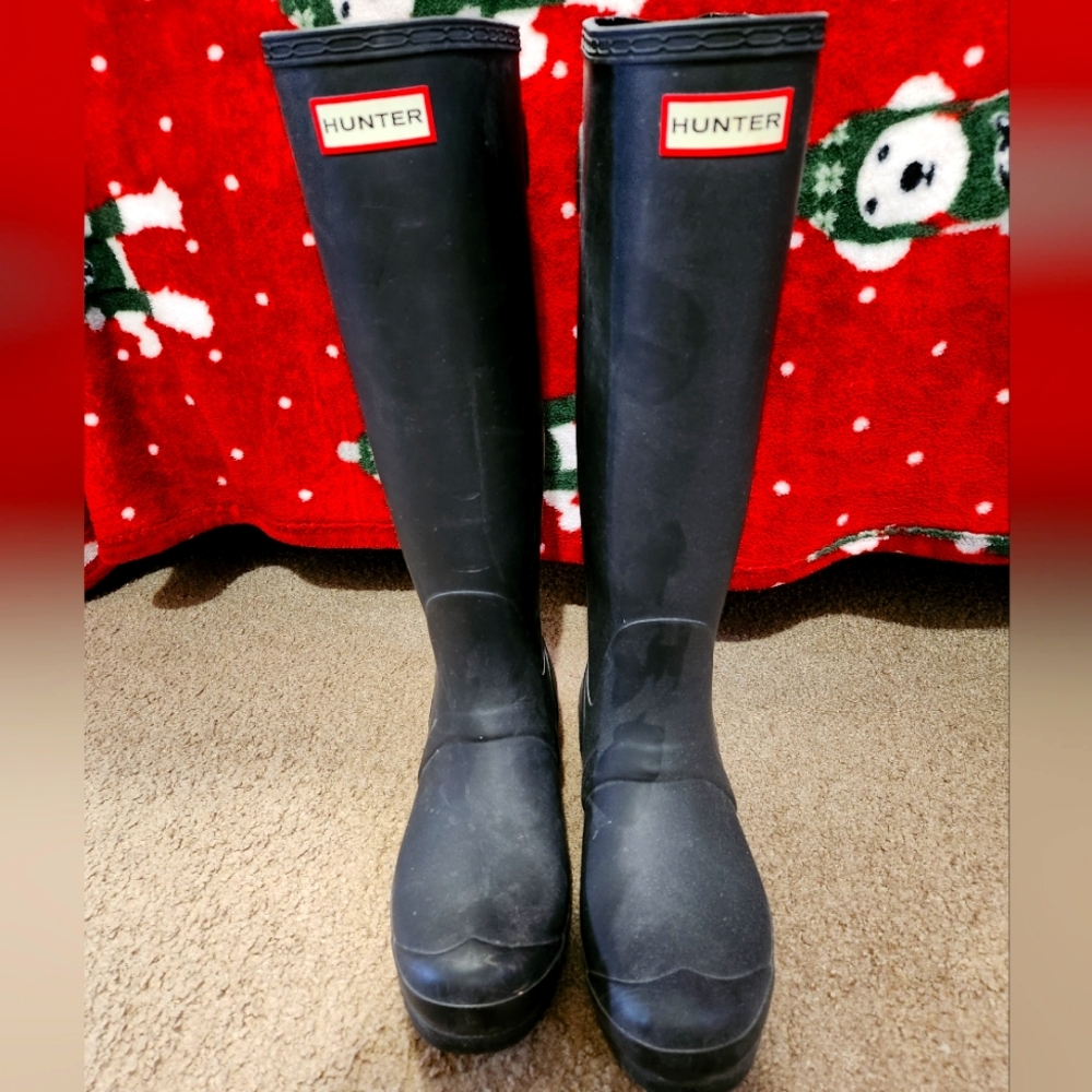 Hunter tall rain boots.